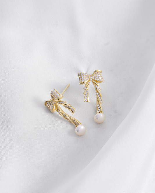 Aretes baño de oro moño en circonitas y perla A50