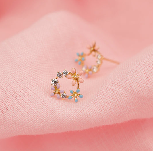 Aretes baño de oro circular con flores y circonitas A19