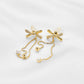 Aretes baño de oro en x con circonitas IM4 - A34